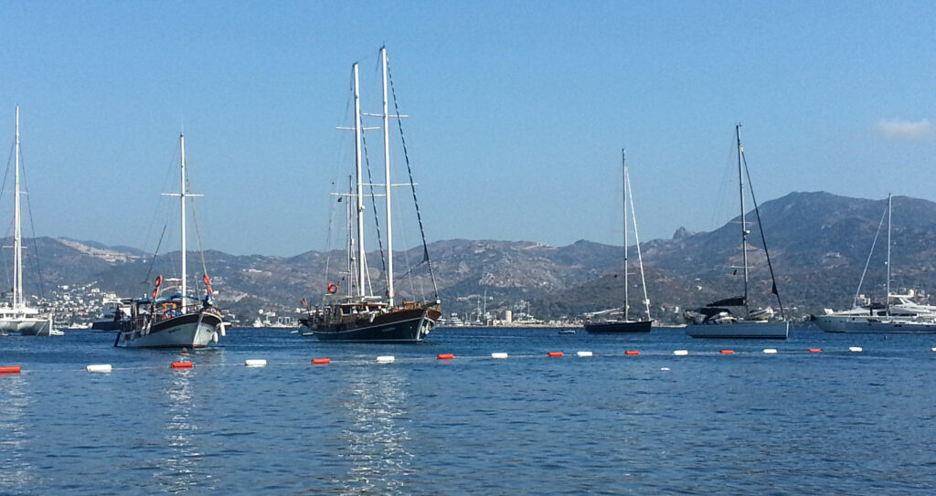 Sailboats and gulets moored in Bodrum Marina with mountain backdrop Turkey fine art travel photography by Hadi Baradaran ArtQuestor
