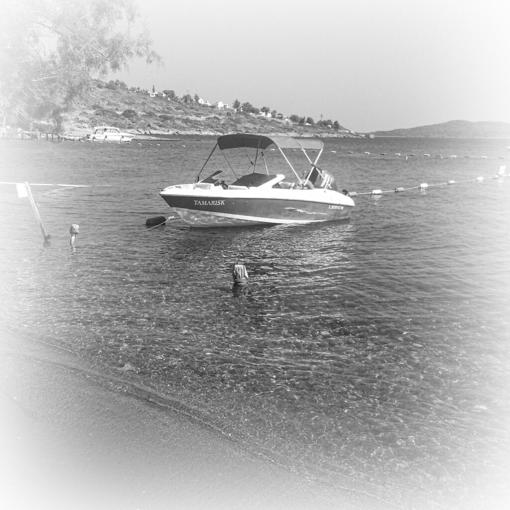 Black and white boat on calm waters coastline Bodrum Turkey fine art travel photography by Hadi Baradaran ArtQuestor