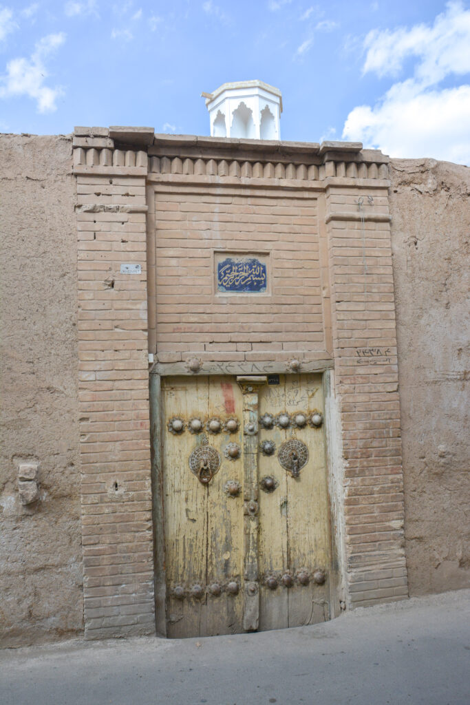 Old ornate wooden door traditional Persian home Kashan Iran fine art street photography by Hadi Baradaran ArtQuestor
