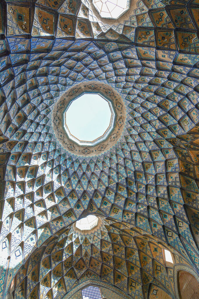 Ornate octagonal Timche dome with muqarnas and skylight Kashan Bazaar Iran fine art architectural photography by Hadi Baradaran ArtQuesto