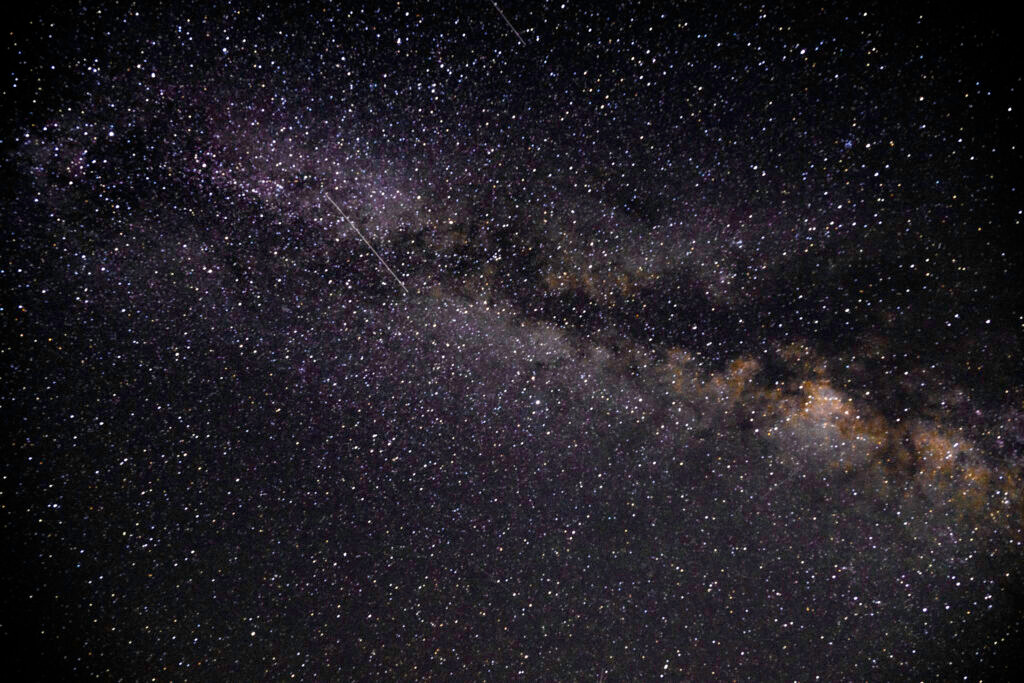 Milky Way galaxy purple gold tones wide field night sky Yosemite National Park California astrophotography by Hadi Baradaran ArtQuestor