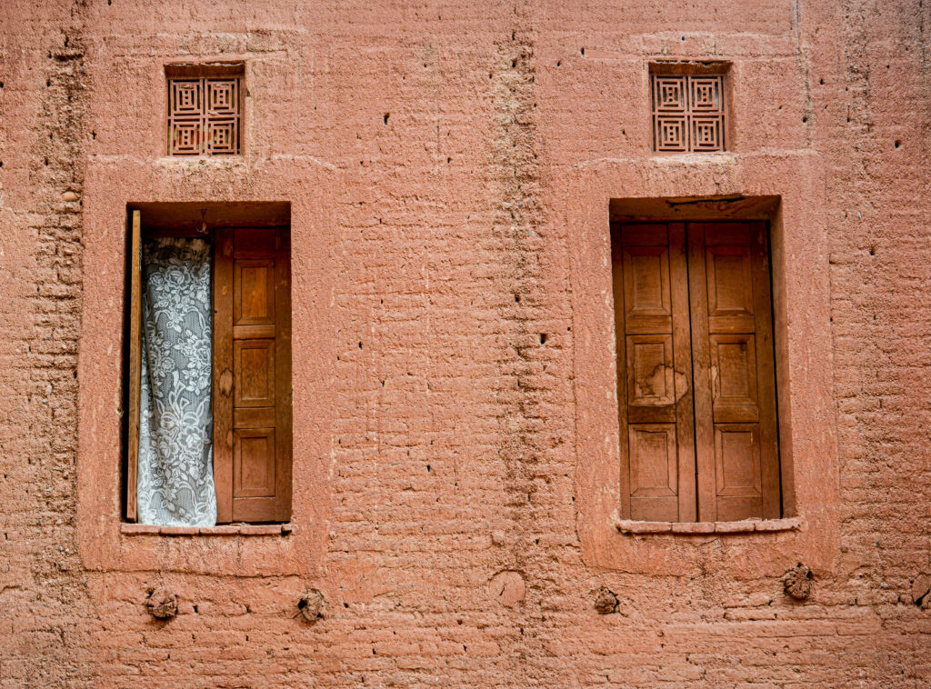 Abyaneh Iran pink red mud brick wall weathered wooden doors ancient village fine art architectural photography by Hadi Baradaran ArtQuestor