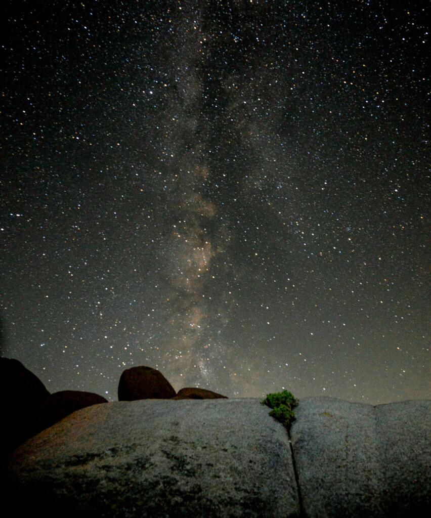Milky Way rising over silhouetted desert landscape Joshua Tree National Park California astrophotography by Hadi Baradaran ArtQuestor