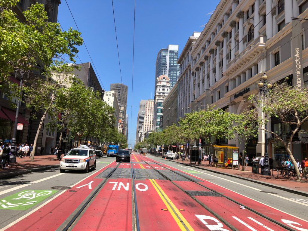 Colorful urban street scene with red lanes and city architecture San Francisco California fine art travel photography by Hadi Baradaran ArtQuestor