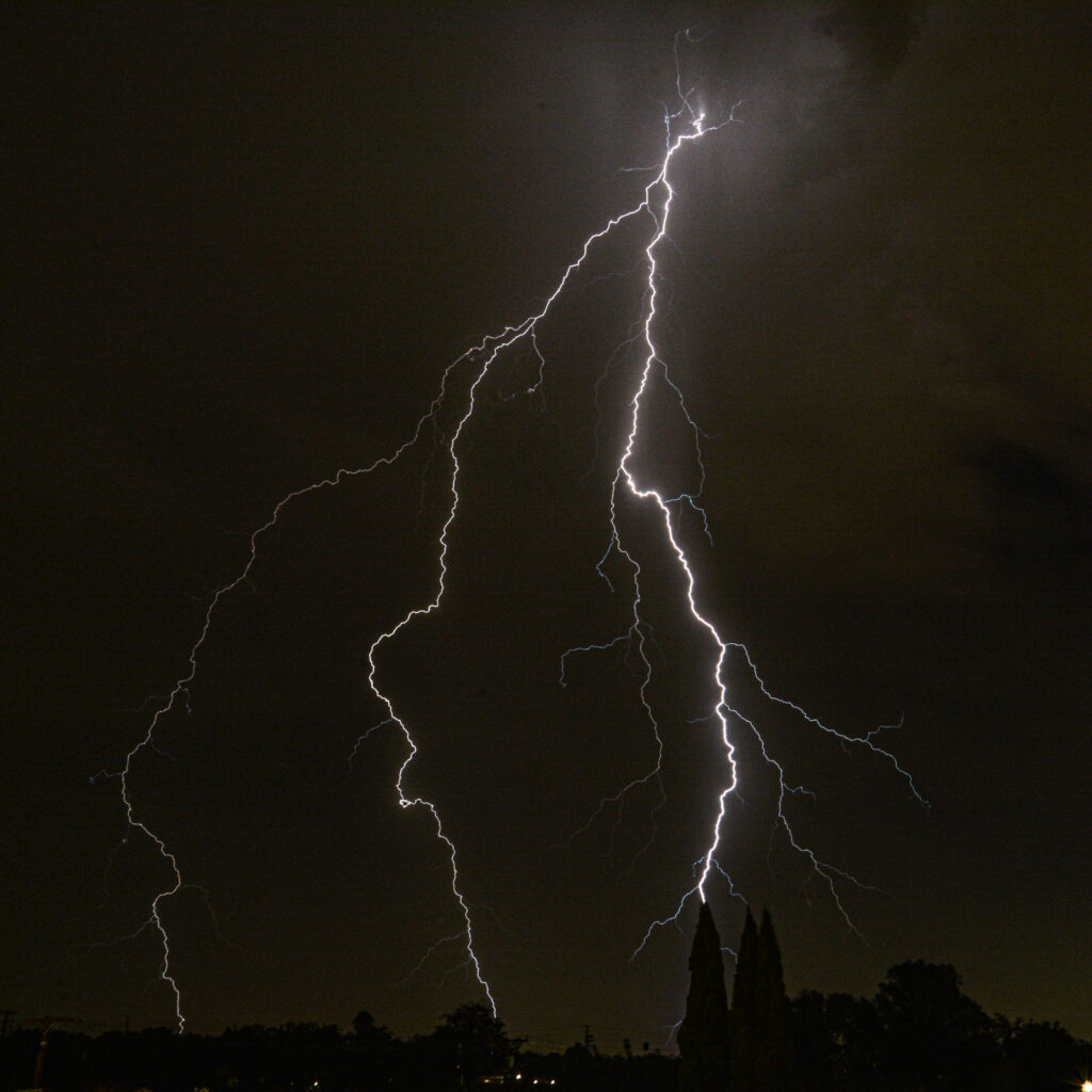 Dramatic lightning bolt striking dark night sky fine art storm weather photography by Hadi Baradaran ArtQuestor