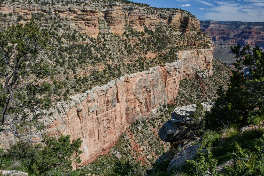 Grand Canyon canyon wall aerial view red orange rock layers Arizona fine art photography by Hadi Baradaran ArtQuestor