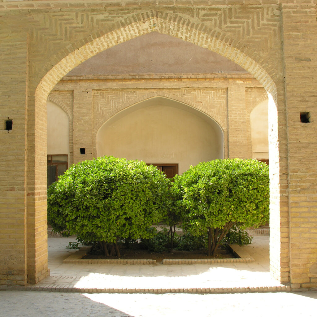traditional Persian courtyard brick arch green shrubs fine art architectural photography print by Hadi Baradaran
